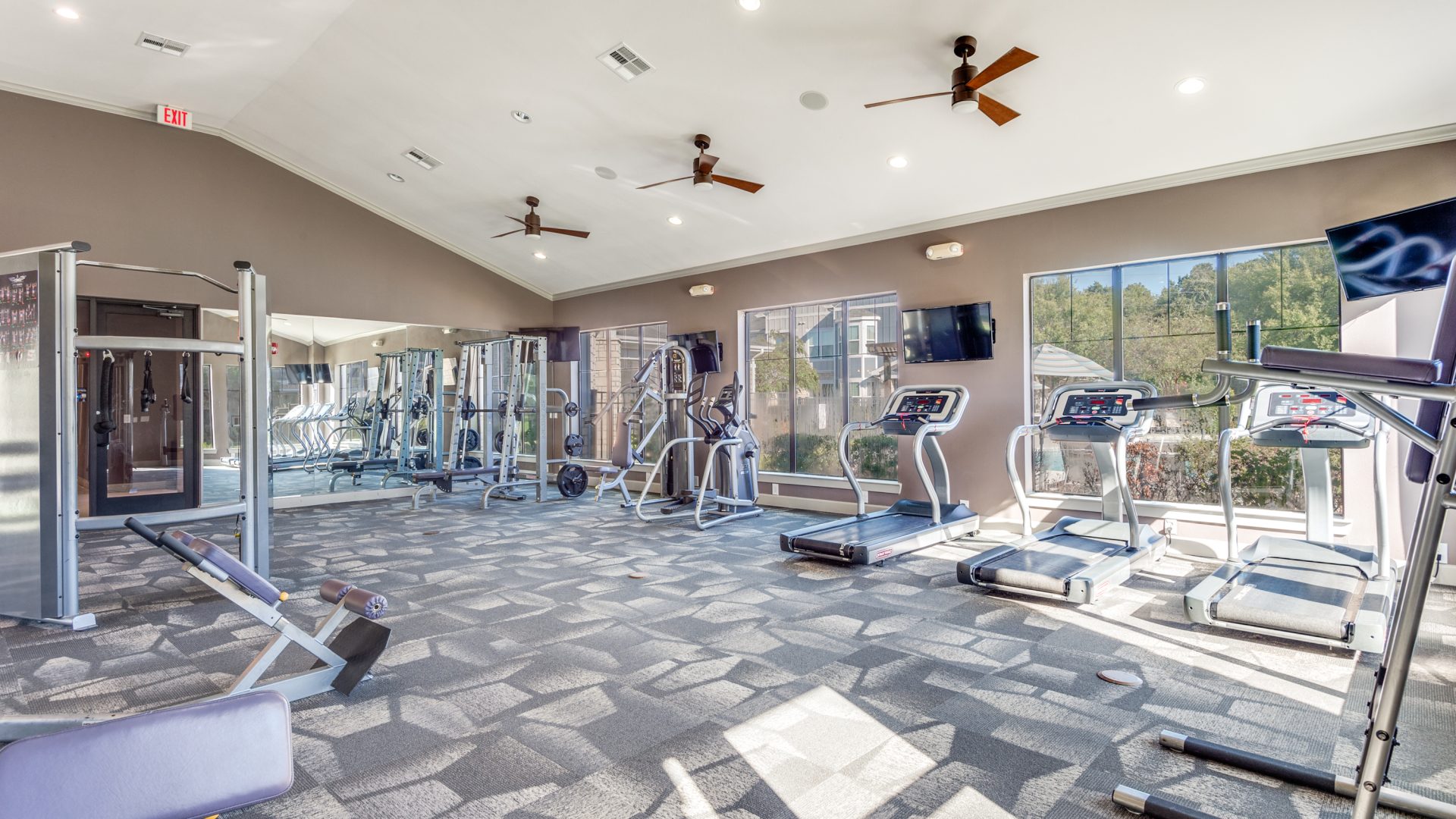 a living room filled with furniture and a large window